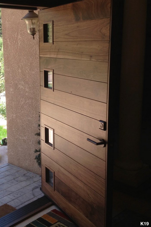 Eame in Walnut with a double bore, deadbolt and lever set